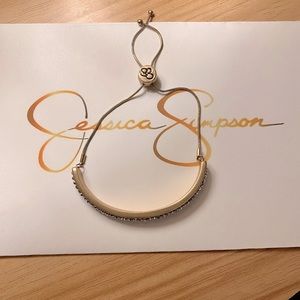 Jessica Simpson Gold Color with Diamond like effect. Adjustable